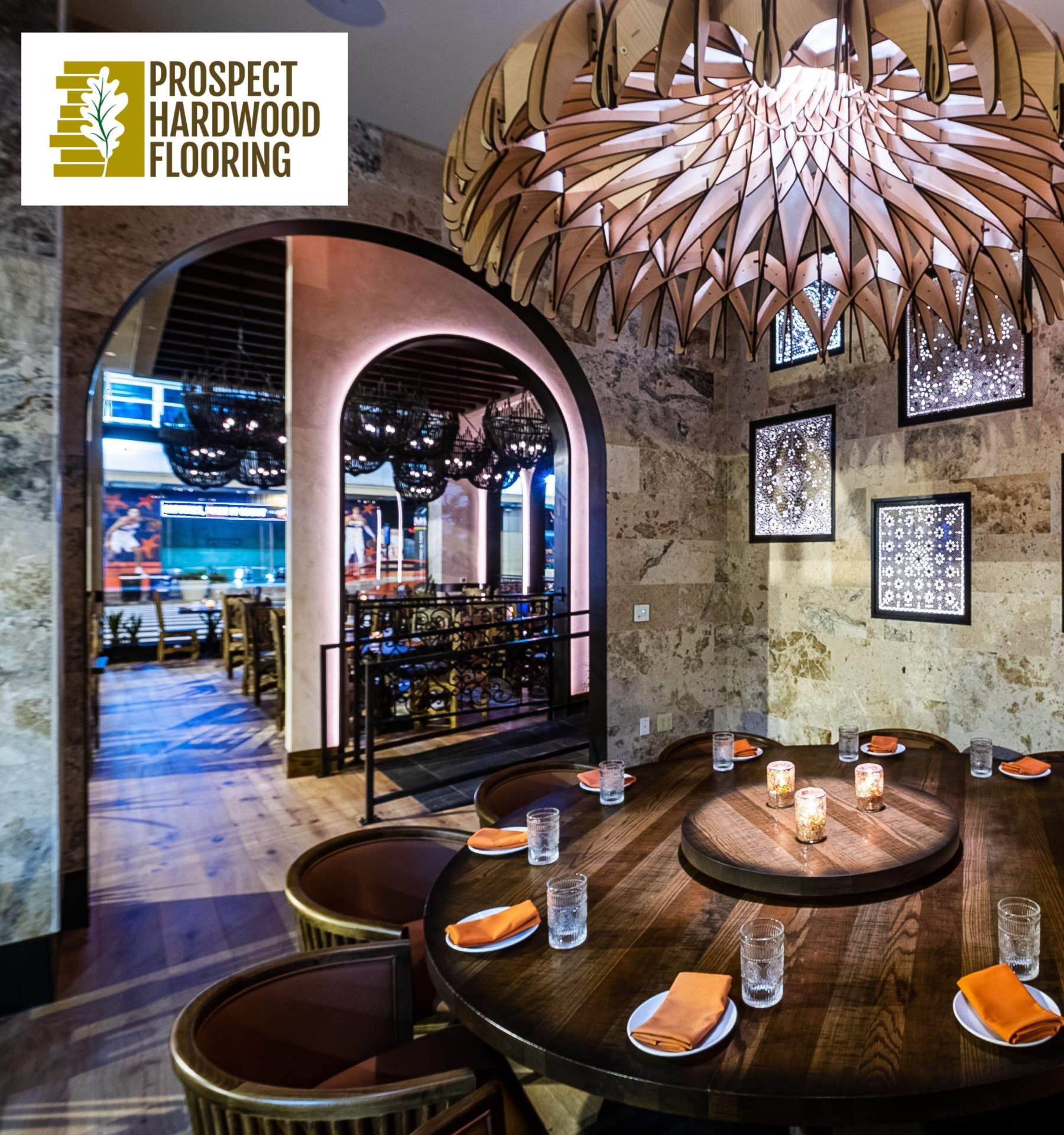 Restaurant dining room in Maryland with wide plank wood flooring installed by Prospect Hardwood Flooring