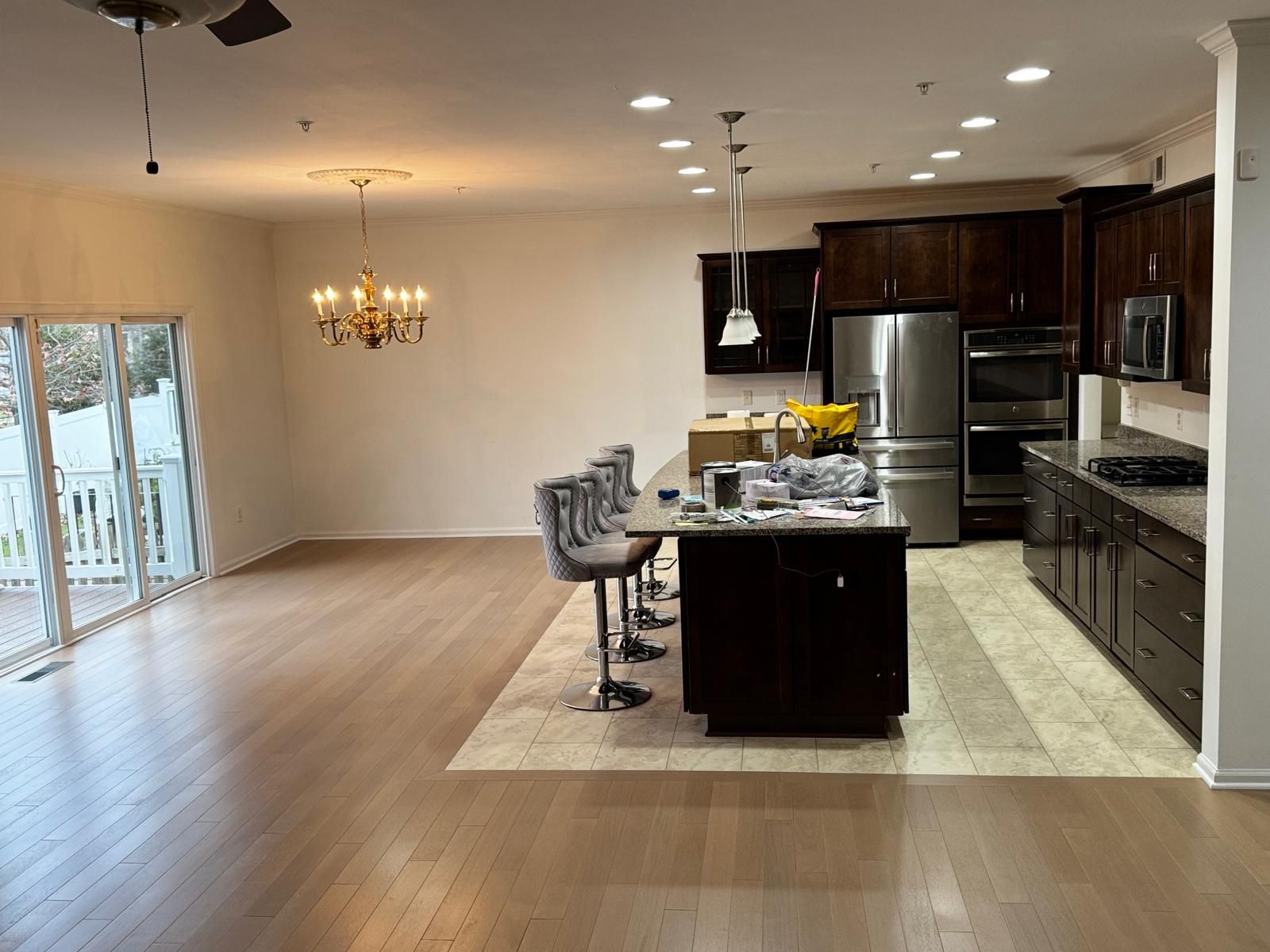 Open kitchen and dining area in a Maryland home with newly installed natural hardwood flooring